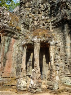 God Indra riding on a 3 headed elephant with sea creatures climbing up the trunks
